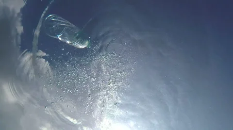 Plastic Bottle Thrown into a Quiet pool of Clear, Fresh Water. Stock-Footage 48757039