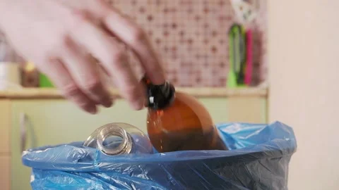 Plastic bottle is thrown into the trash bin Stock Footage 155485569