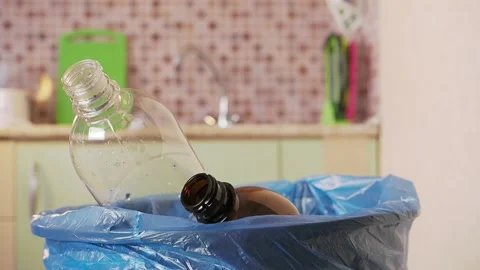 Plastic bottle is thrown into the trash bin Stock Footage 155485607