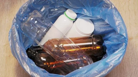 Plastic bottle is thrown into the trash bin Stock Footage 155485676