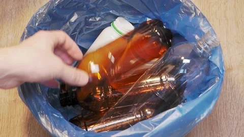 Plastic bottle is thrown into the trash bin Stock Footage 155485820