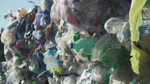 A PLASTIC BOTTLE in the trash Stock Footage 263611861