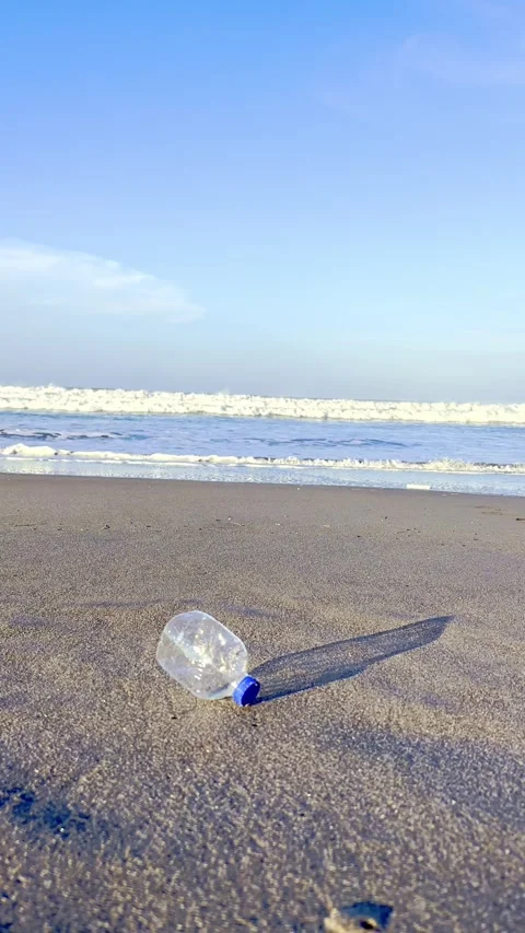 Plastic bottle trash lying on sandy beach Stock-Footage 335431488