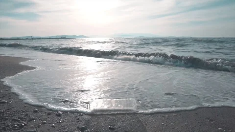 Plastic bottle washed ashore on beach. Environmental trash, waste. Stock Footage 112269657
