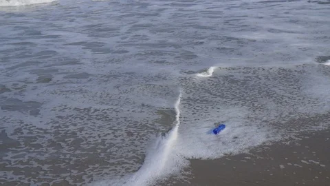Plastic bottle (washed up) at a beach in South America of the Pacific Ocean Video stock 115886926