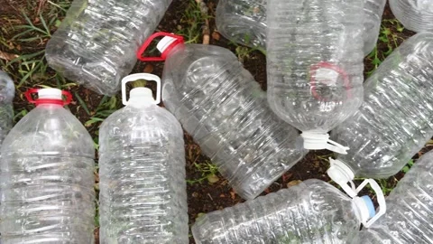 Plastic bottle waste polluting the environment Video stock 338396960
