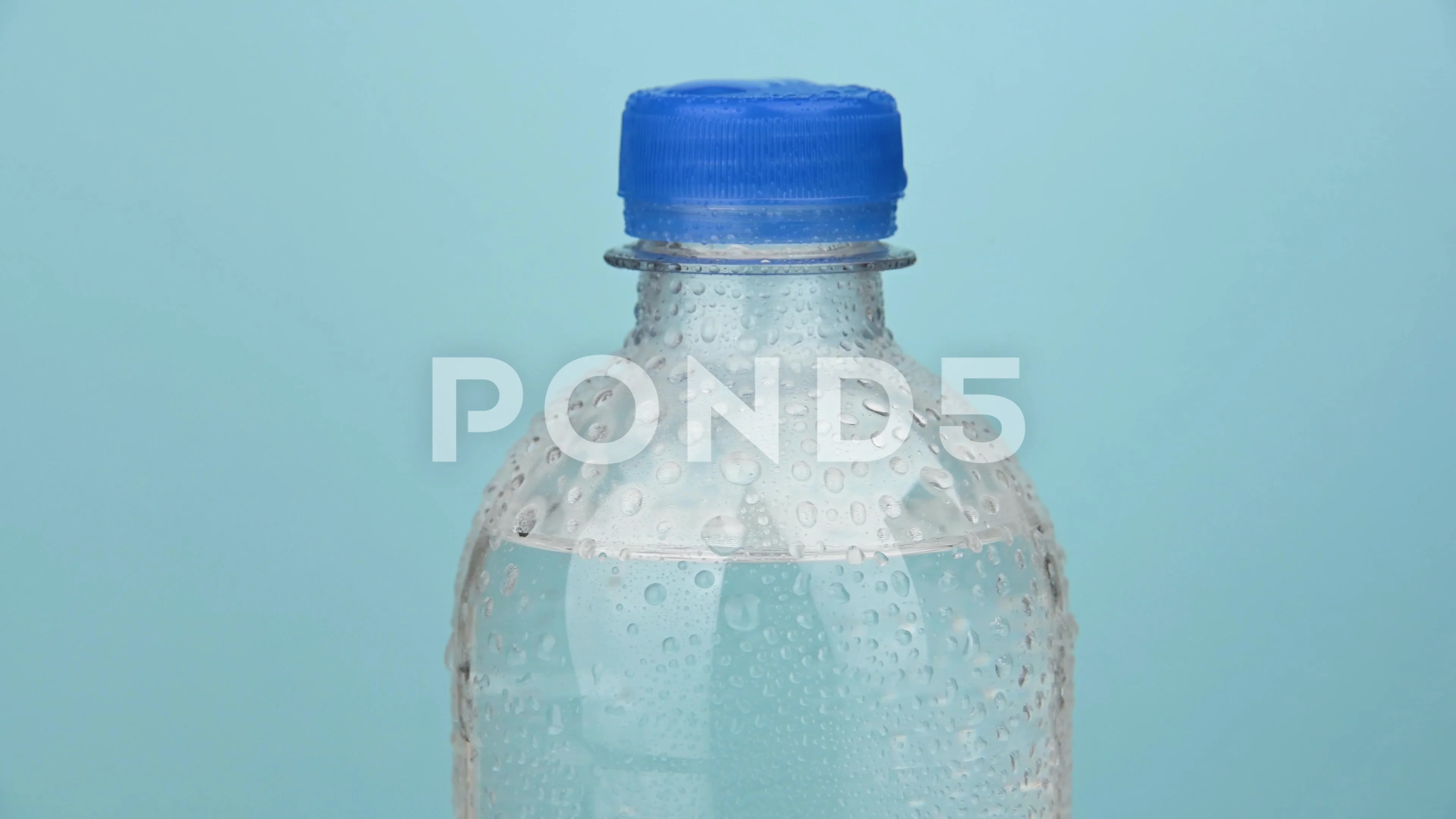 Small Water Plastic Bottle Rotates On Stock Footage Video (100