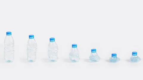 Plastic bottle wave crushing time lapse on white background Plastic pollution Stock Footage 170002564