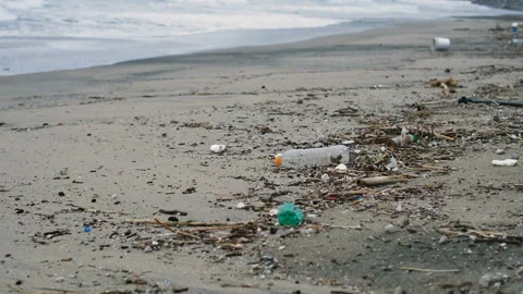 Plastic bottles and containers waste on ocean sea coast,polluted beach ecosystem Video stock 145932110