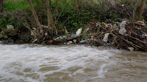 Plastic bottles and garbage in the river Stock Footage 108359230
