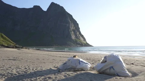 Plastic bottles and other trash on sea beach Stock Footage 126150495