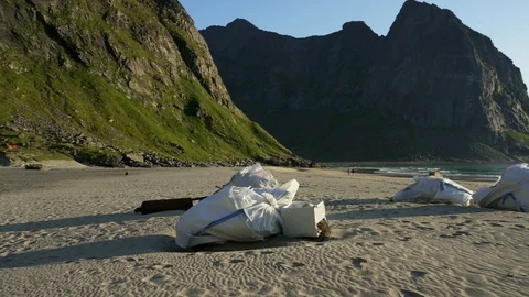 Plastic bottles and other trash on sea beach Stock Footage 126150647
