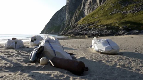 Plastic bottles and other trash on sea beach Stock Footage 126150785