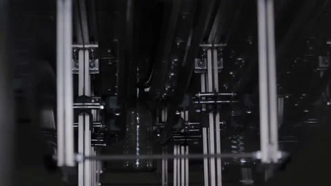 Plastic bottles are moving along the conveyor for filling Stock Footage 98724639