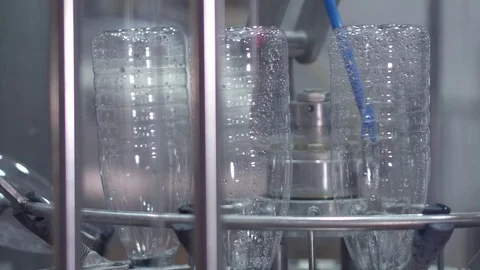 Plastic bottles are washed, dried, filled milk Stock Footage 70749272