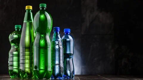 Plastic bottles of assorted carbonated soft drinks. Stock Photos