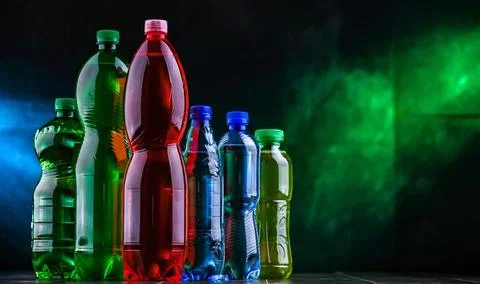 Plastic bottles of assorted carbonated soft drinks. Stock Photos