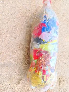 Plastic bottles on the beach Stock Photos