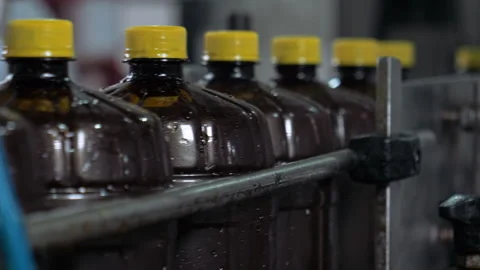 Plastic Bottles With Beer Moving In Row At Production Factory At Close Up Stock Footage 220895508