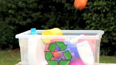 Plastic bottles being dropped into recycle bin Stock Footage 42789137