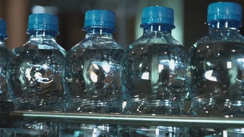 Plastic bottles with blue cap Stock Footage 86809371