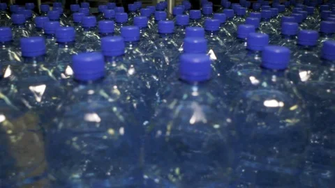 Plastic bottles with blue cap at the water plant Stock-Footage 97958359