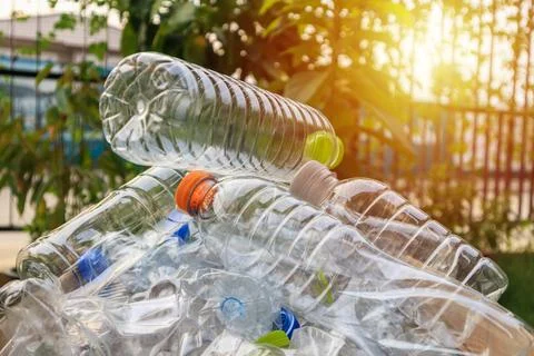 Plastic bottles in brown recycle garbage box Stock Photos