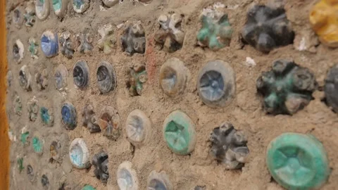 Plastic bottles cemented in a wall, recycled wall made of plastic bottles. Stock-Footage 208849395