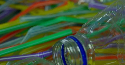 Plastic Bottles With Colourful Straws Floating On Water Polluting Ocean  Stock Footage 113382893