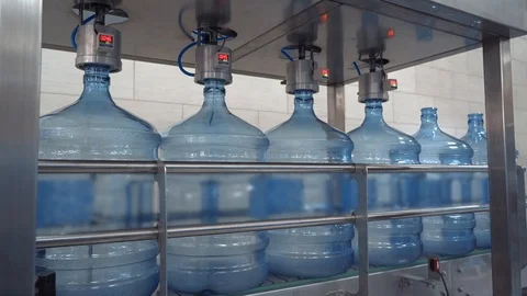 Plastic bottles on conveyor for checking integrity of containers under pressure Stock Footage 118166024