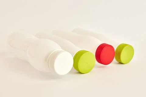 Plastic bottles for drinks on a white background. Plastic packaging. Disposal of Stock Photos