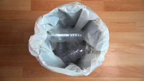 Plastic Bottles Dropped Into White Bin Stock Footage 157174267