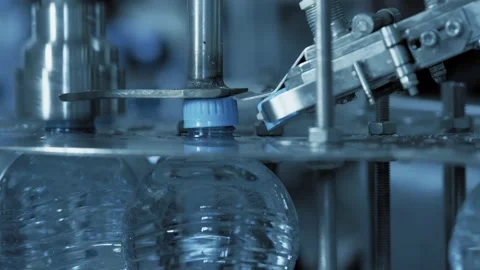 Plastic bottles filled with clean water on Automatic belt line at plant Stock Footage 130252949