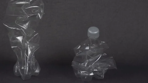 Plastic bottles on gray background Stock Footage 116571284