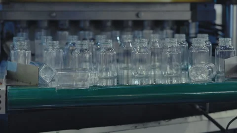Plastic Bottles Move on the Conveyor. Plastic Blanks Advance Along the Linear Video stock 249417718
