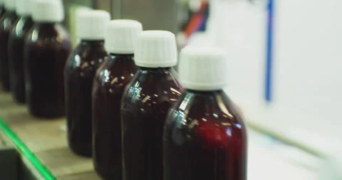 Plastic bottles move quickly along the conveyor.close-up. Stock Footage 208683963