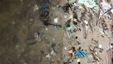 Plastic bottles pollute beach Видео 90809177