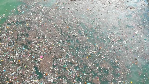 Plastic bottles in a polluted river water Video stock 91941790