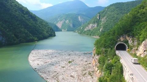 Plastic bottles in a polluted river water Stock Footage 91943567