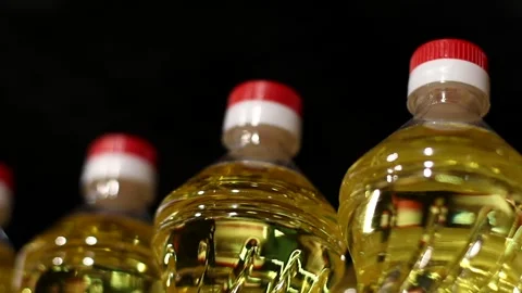Plastic Bottles with Sunflower or Corn Oil on Supermarket Shelf or Warehouse Stock Footage 274038669
