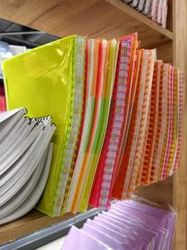 Plastic-bound notebooks with soft covers in an array of vibrant colors, for.. Stock Photos