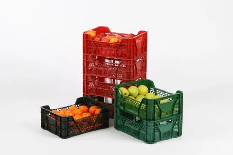 Plastic box with apples on a white background Stock Photos