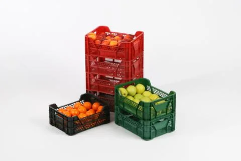 Plastic box with apples on a white background Stock Photos