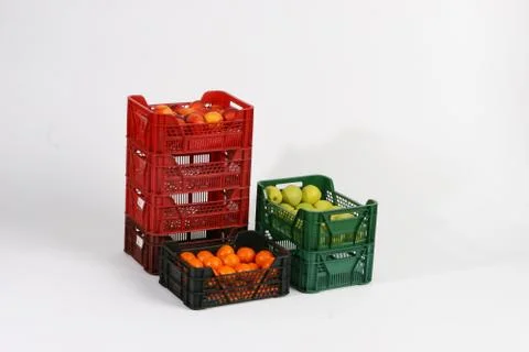 Plastic box with apples on a white background Stock Photos