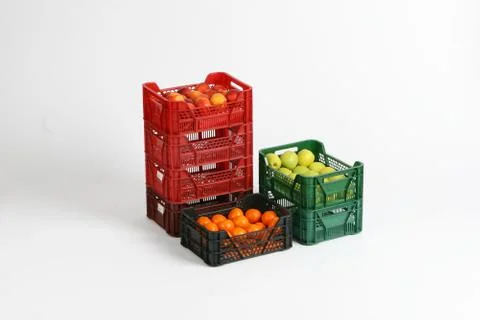 Plastic box with apples on a white background Stock Photos