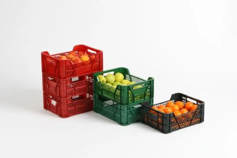 Plastic box with apples on a white background Stock Photos