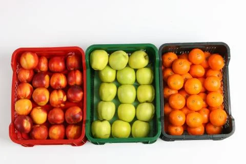 Plastic box with apples on a white background Stock Photos