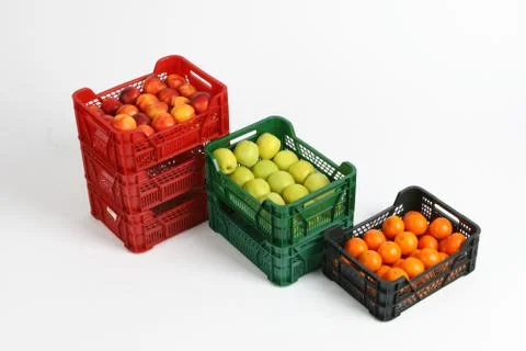 Plastic box with apples on a white background Stock Photos
