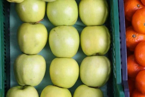 Plastic box with apples on a white background Stock Photos