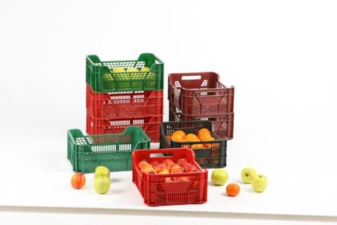 Plastic box with apples on a white background Stock Photos